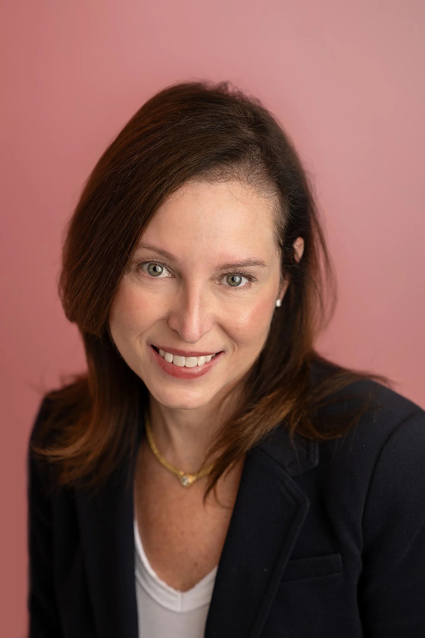 woman headshot on pink background