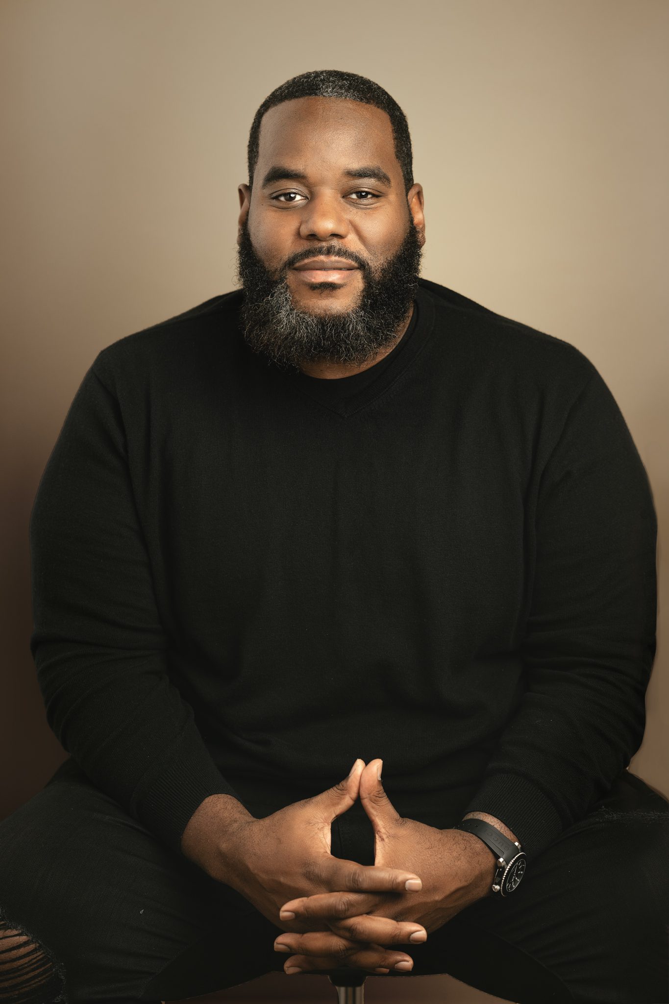 man headshot on tan background