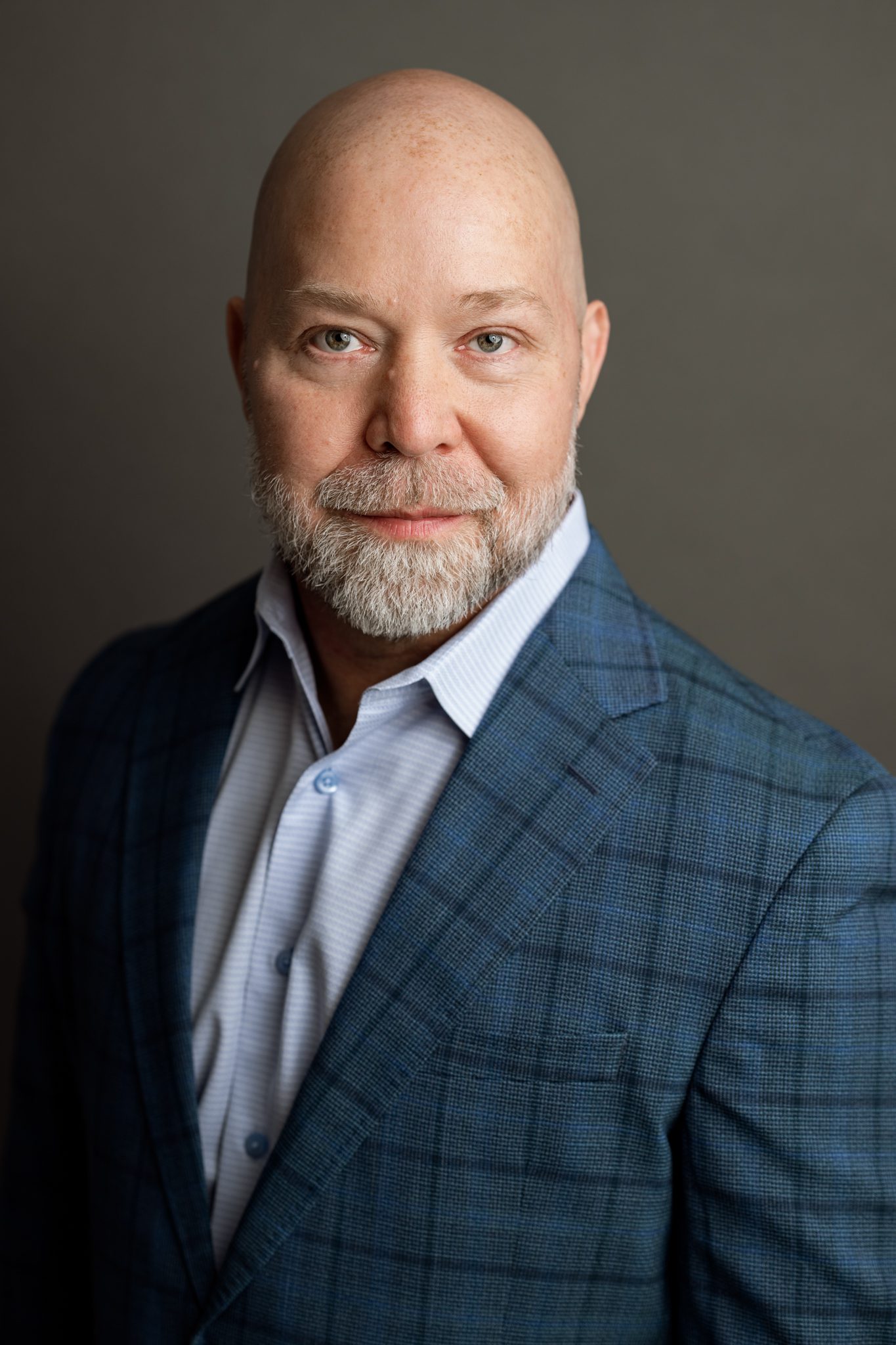 bald man with beard poses for a formal headshot in westfield nj