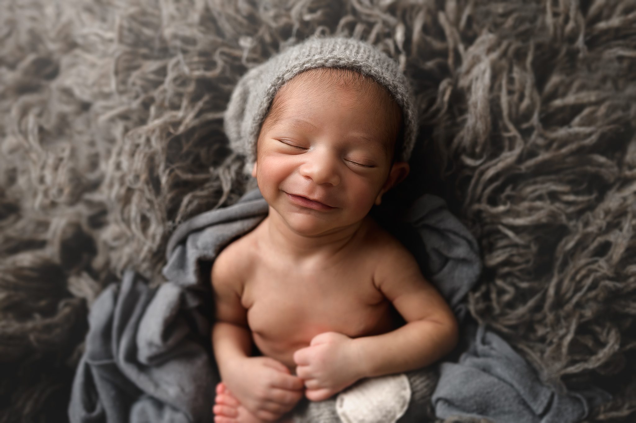 portrait of little newborn boy smiling