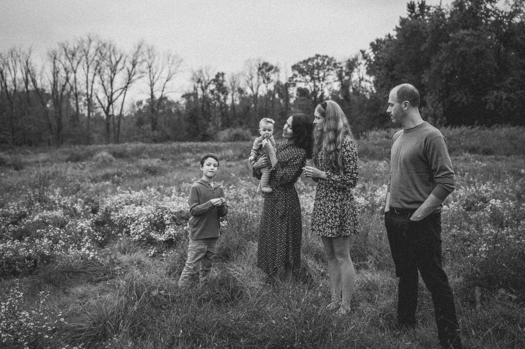 family plays and has fun at their outdoor family photography session