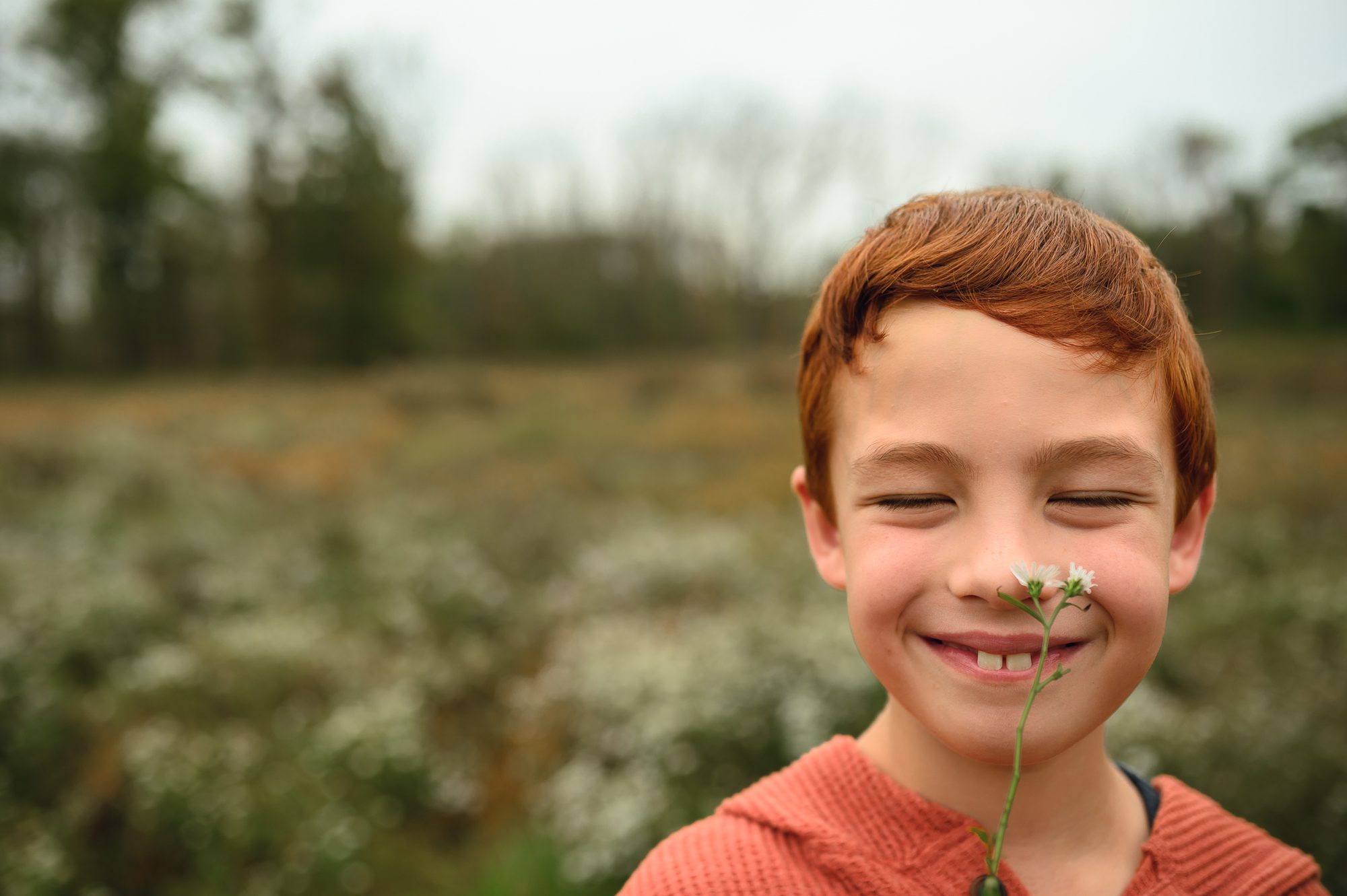 family plays and has fun at their outdoor family photography session