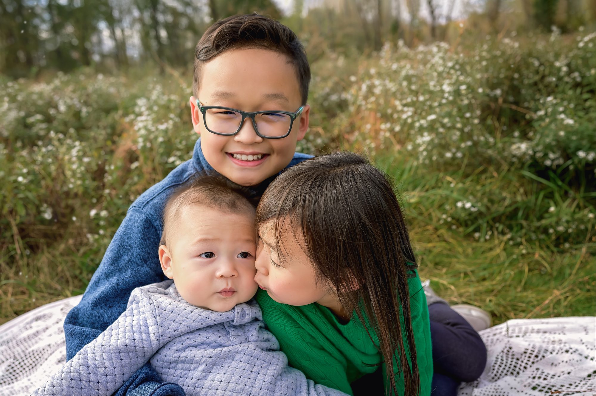 family plays and has fun at their outdoor family photography session
