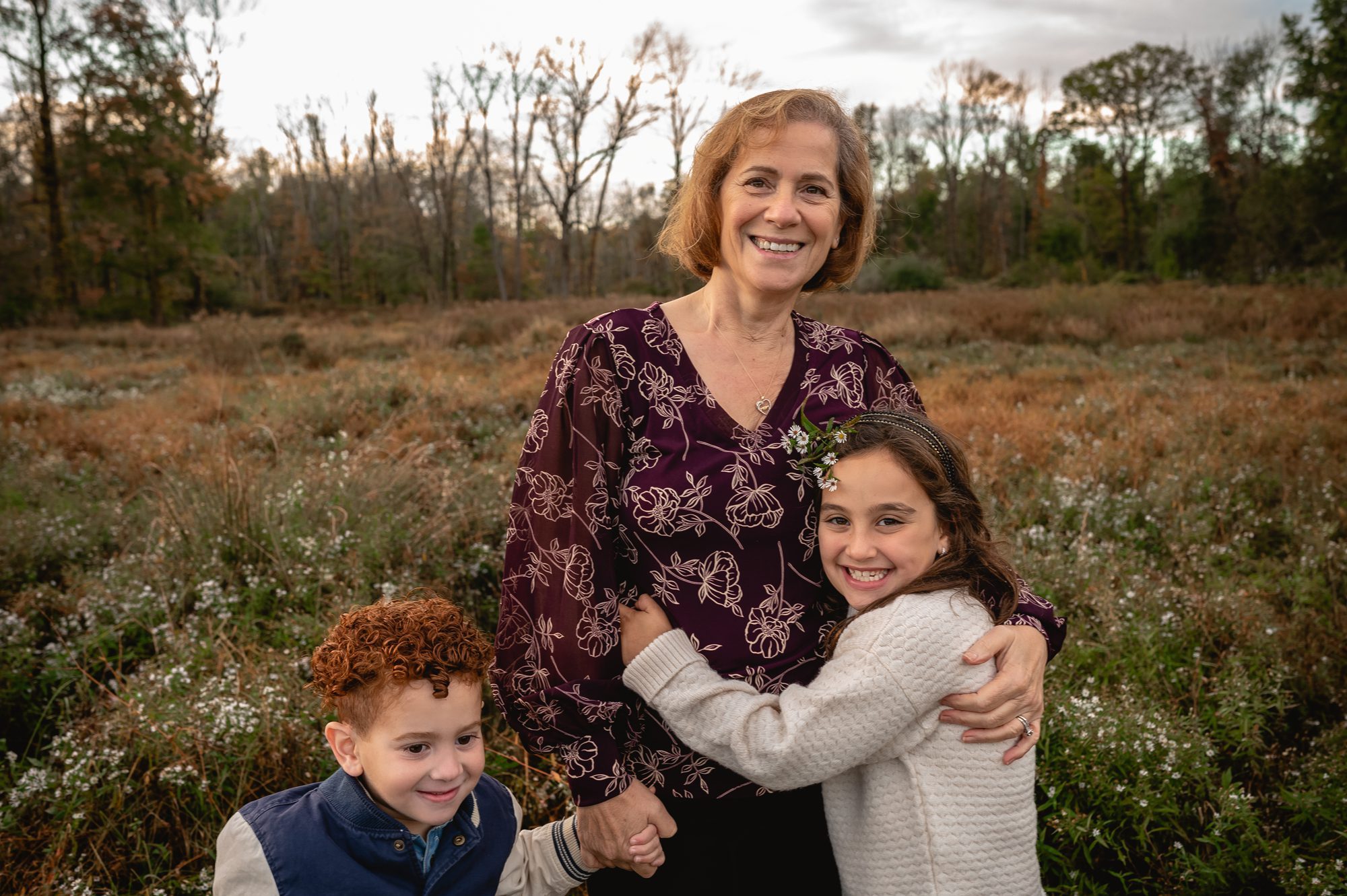 family plays and has fun at their outdoor family photography session