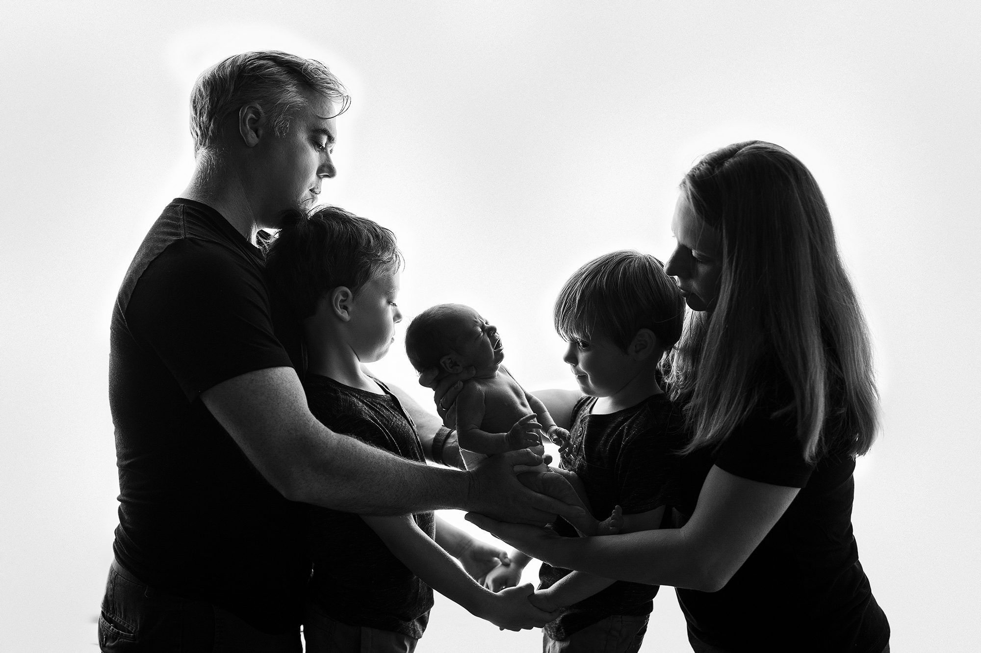 family of 5 black and white with newborn