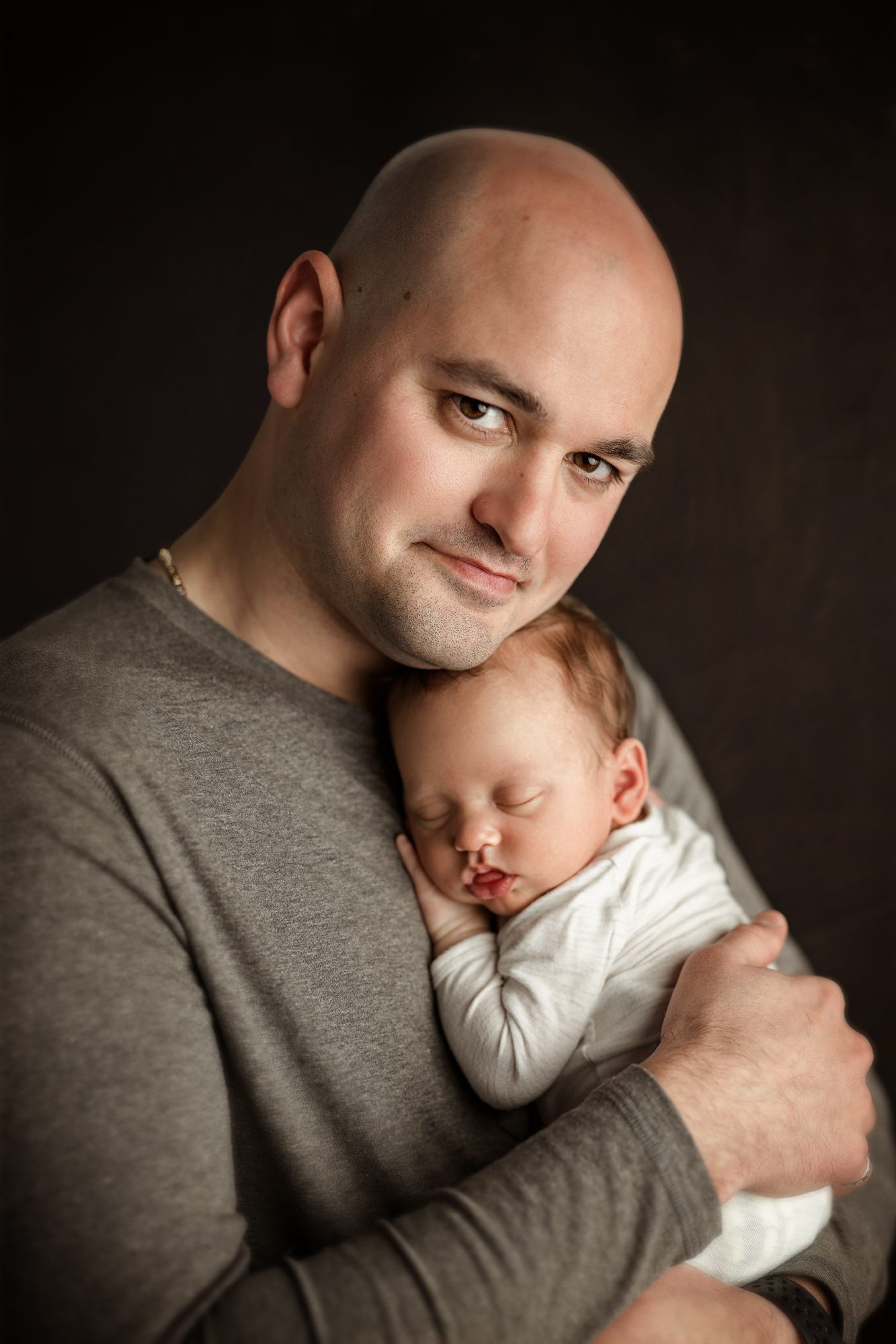Father holding his newborn son