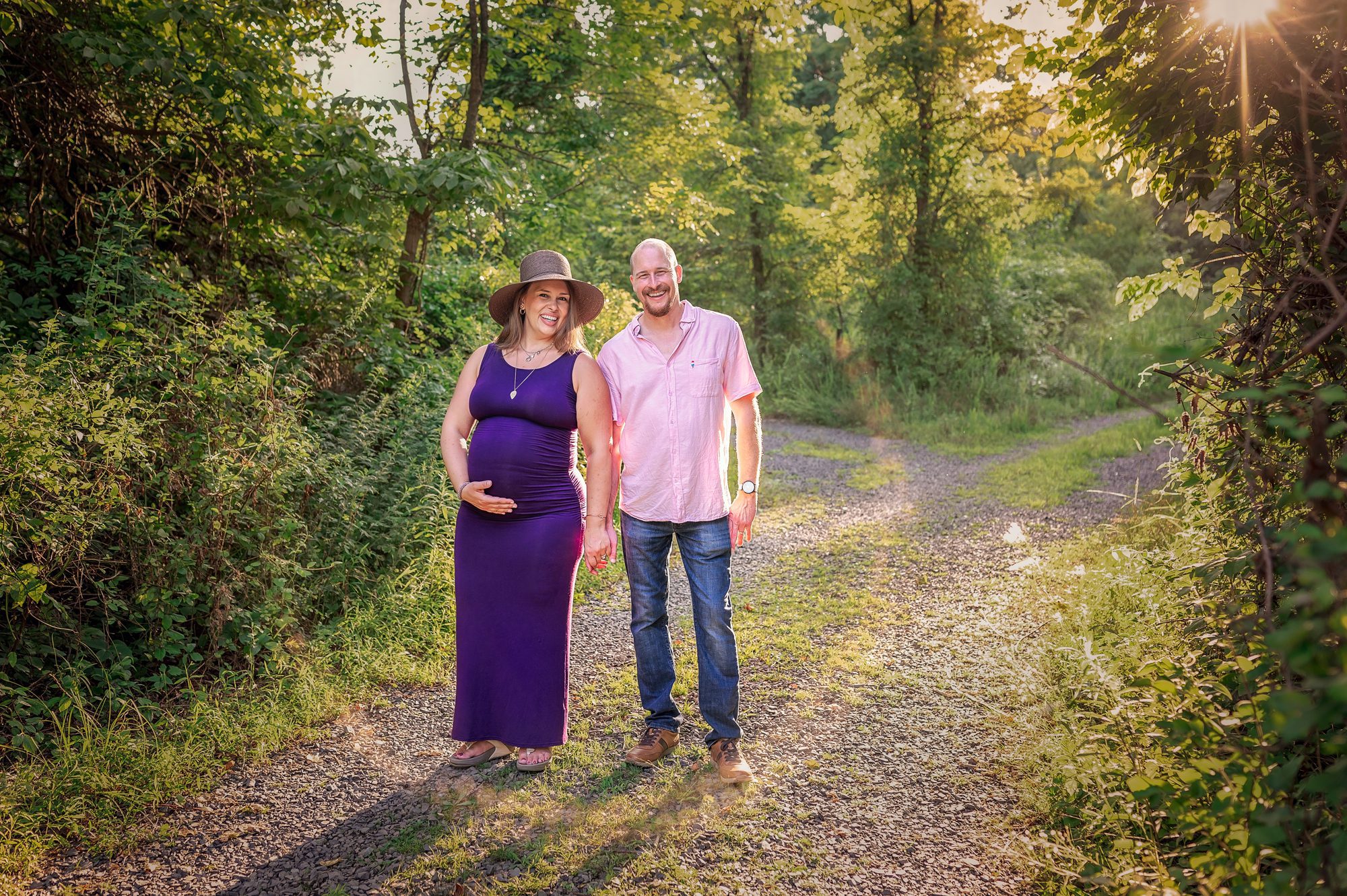 mom and dad pose at their outdoor maternity session