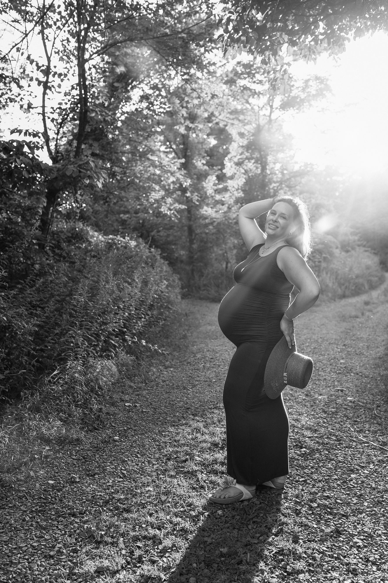 mom strikes a pose at her maternity session