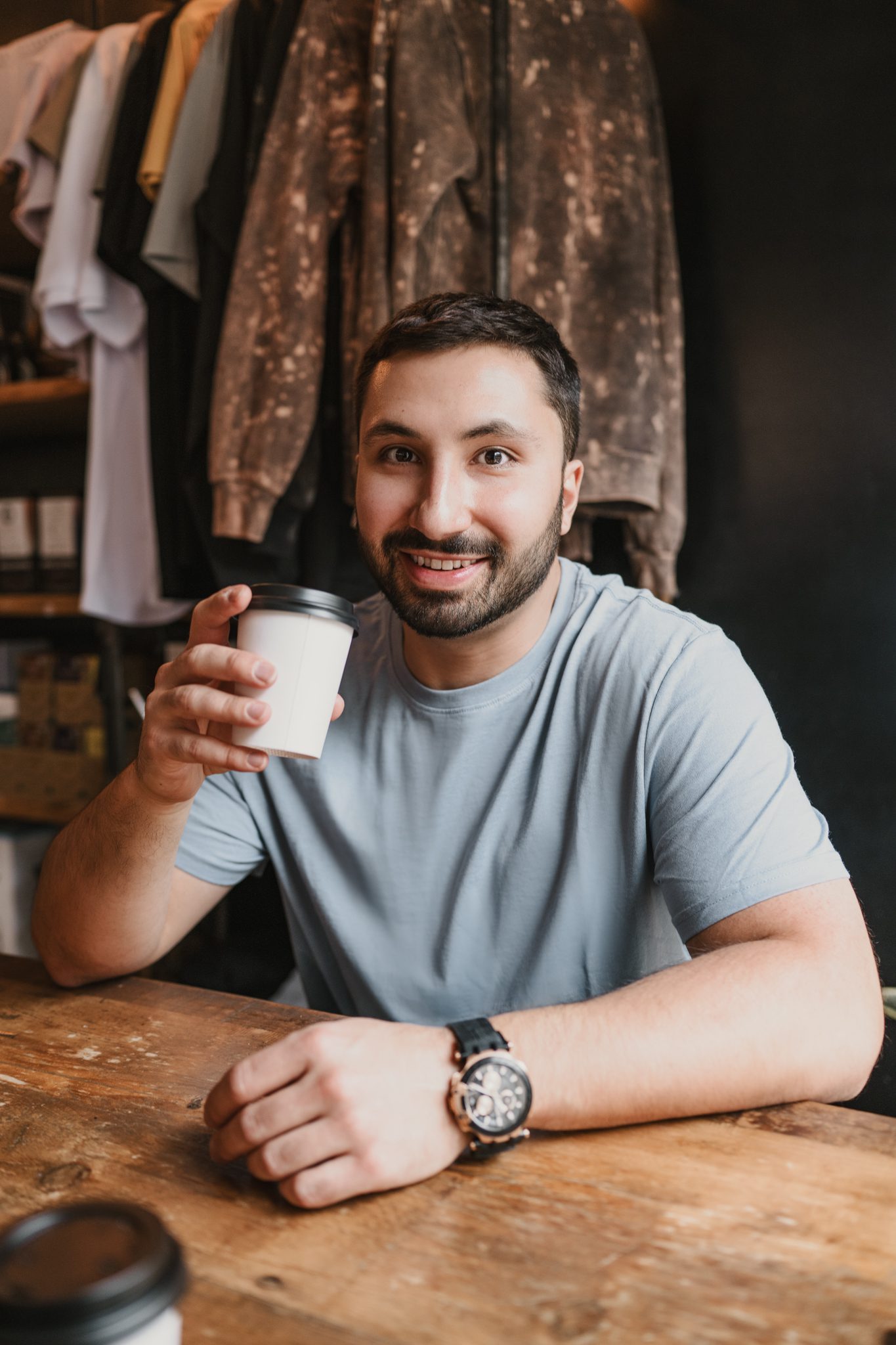 young man with brown hair and facial hair poses for his dating profile photography shoot with Joan Marie Photography in Somerville NJ