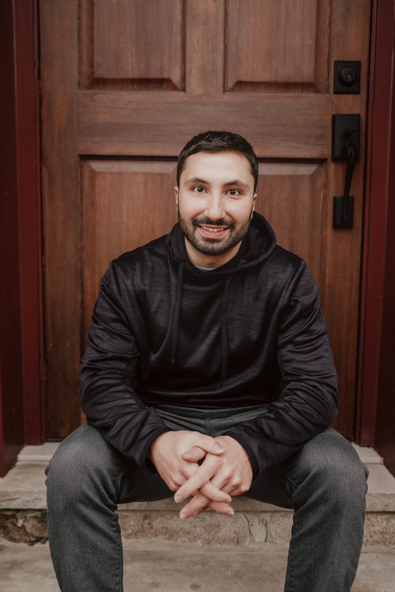 young man with brown hair and facial hair poses for his dating profile photography shoot with Joan Marie Photography in Somerville NJ