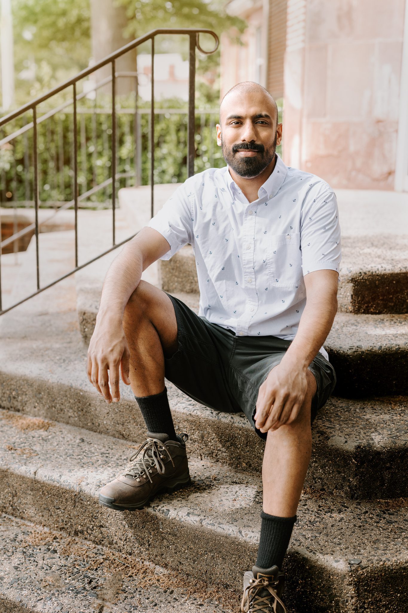 Young man with beard has photos taken for online dating apps