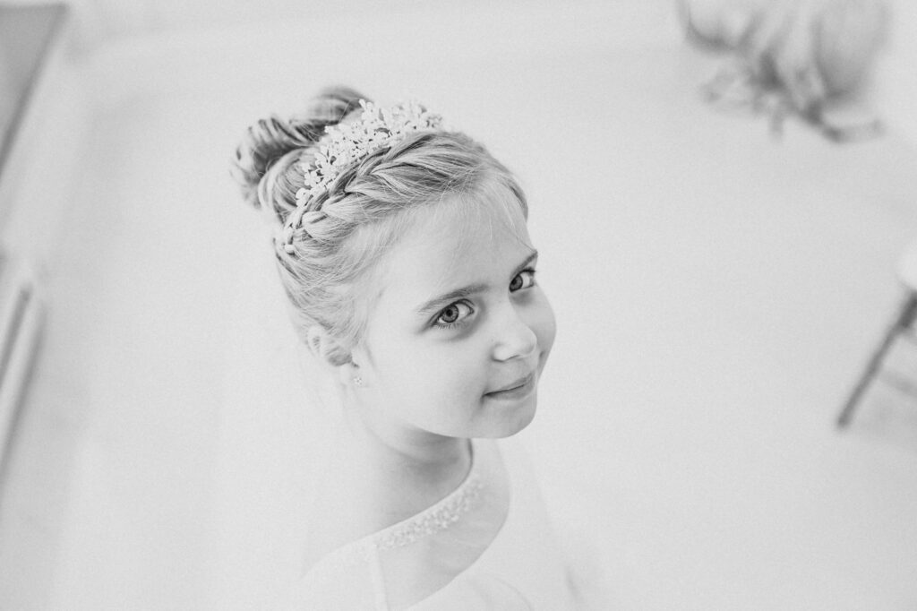 little communion girl poses for her portraits at il tulipano reception party
