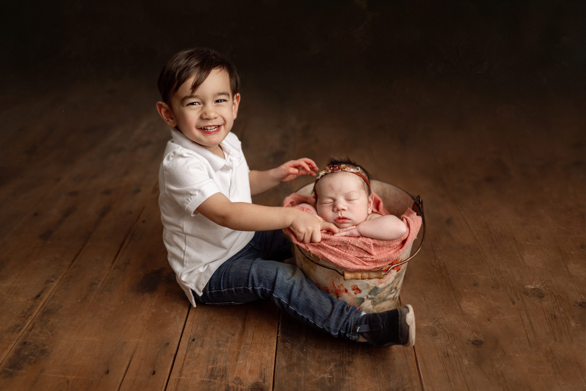 Sibling newborn photography Union County NJ featuring toddler brother and baby sister.