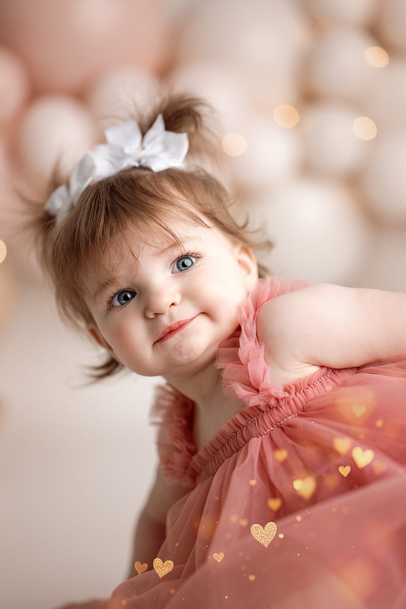 1 year old girl closeup at her first birthday cake smash