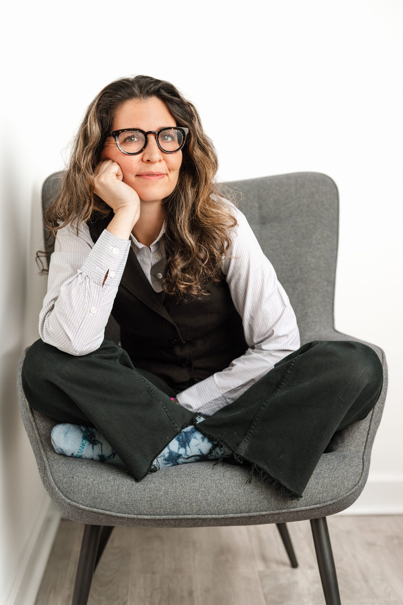 woman in chair at her personal branding portrait session with joan marie photography