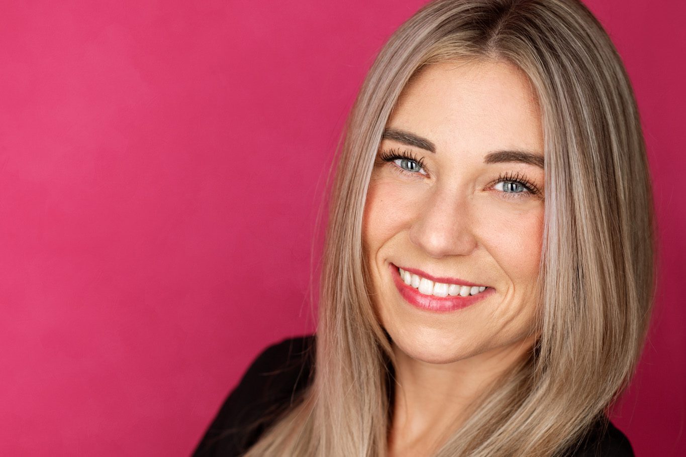 Professional headshot in Scotch Plains NJ using a hot pink backdrop and strip lighting.