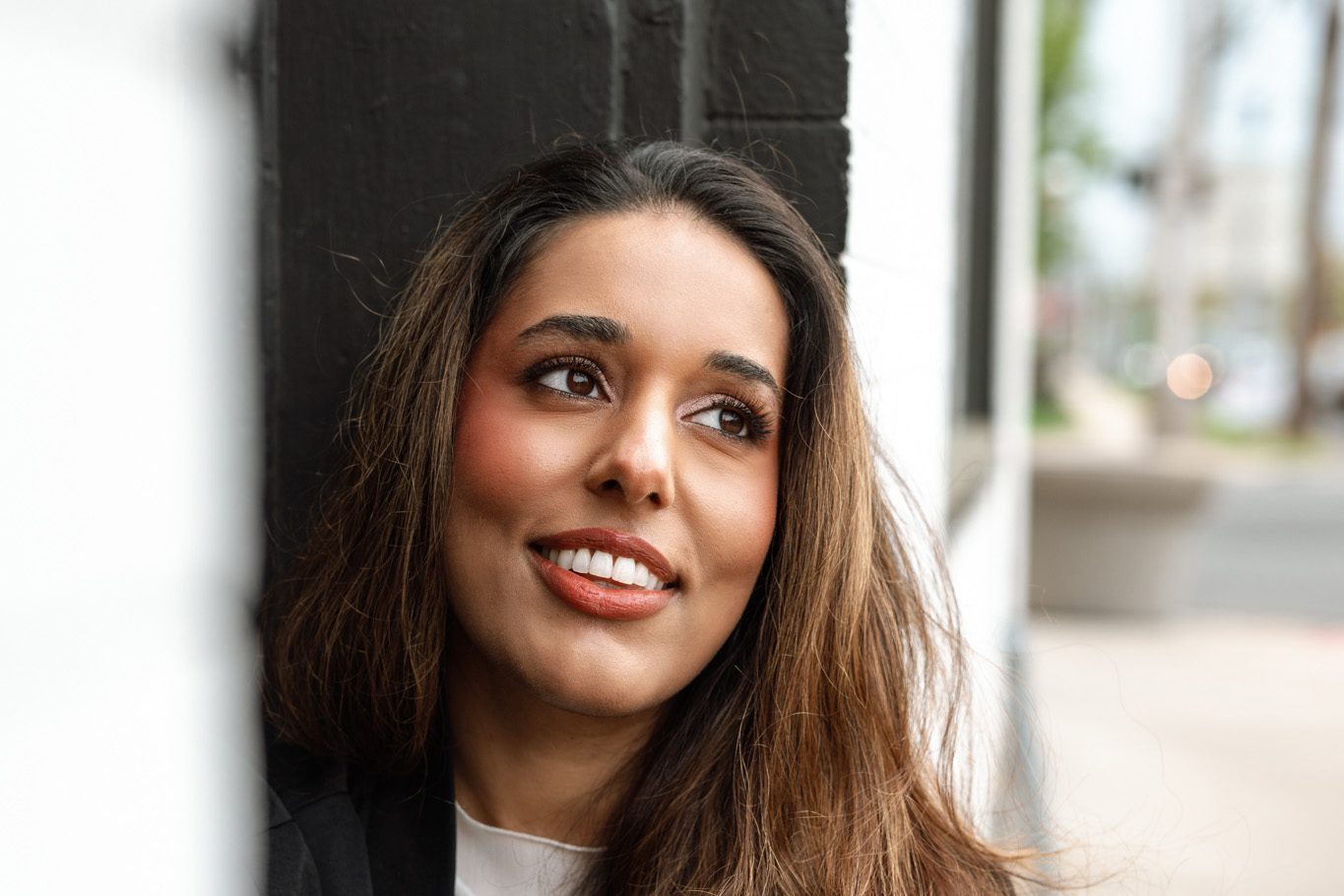 Close-up portrait of a woman in Metuchen, NJ, featuring soft glam makeup by lovemarkbeauty for a dating profile photography session.