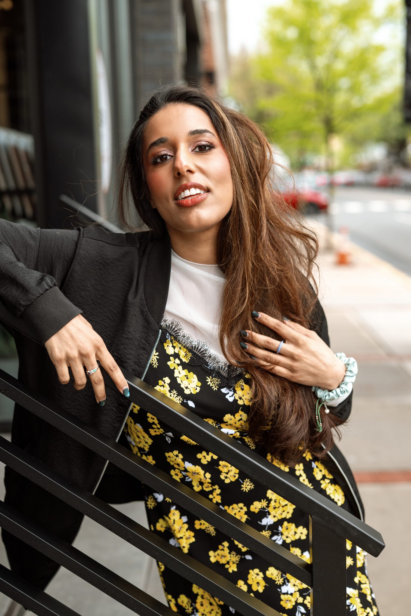 A stylish woman wearing European-inspired fashion during a dating profile photoshoot in downtown Metuchen.