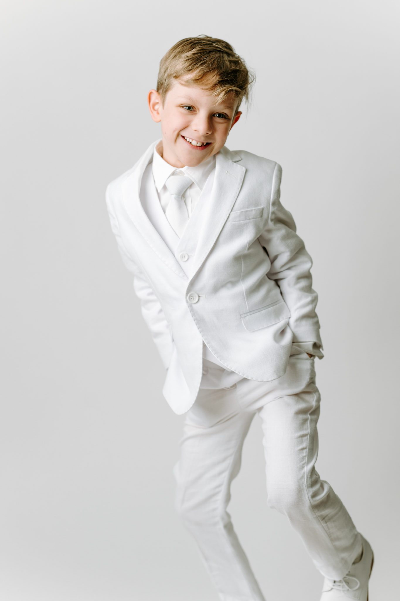 Young boy in a suit for a Communion portrait session in Scotch Plains New Jersey.