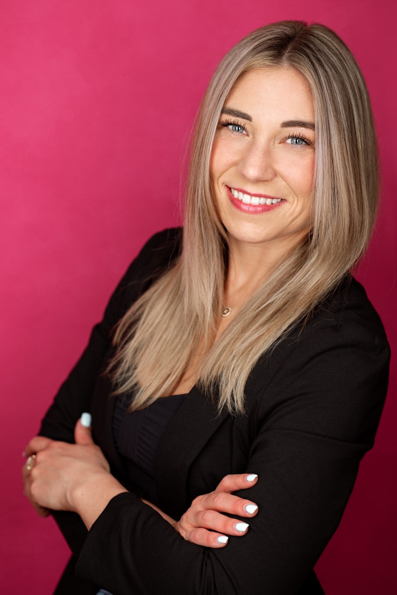 Professional headshot in Scotch Plains NJ using a hot pink backdrop and strip lighting.
